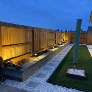 Illuminated backyard walkway and turf